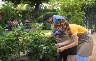 side-view-women-taking-care-flowers